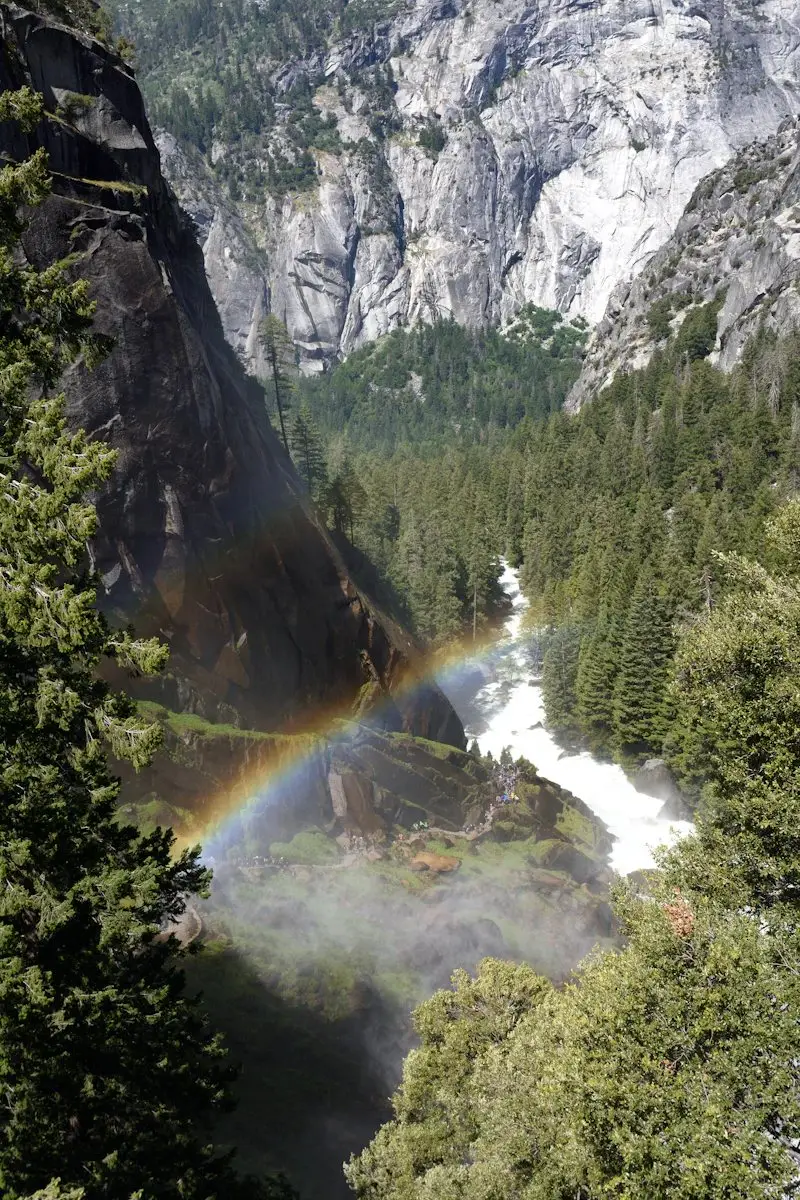 A rainbow in the spray at the base of Vernal Fall seen from the Mist Trail